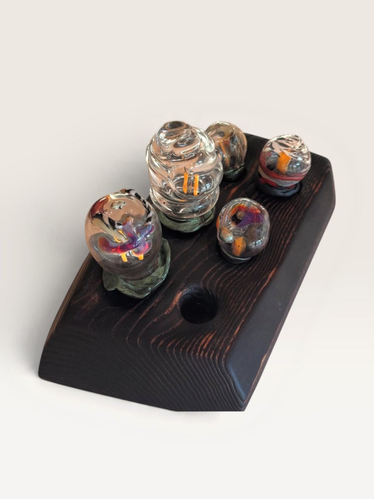 Glass objects on dark wooden display