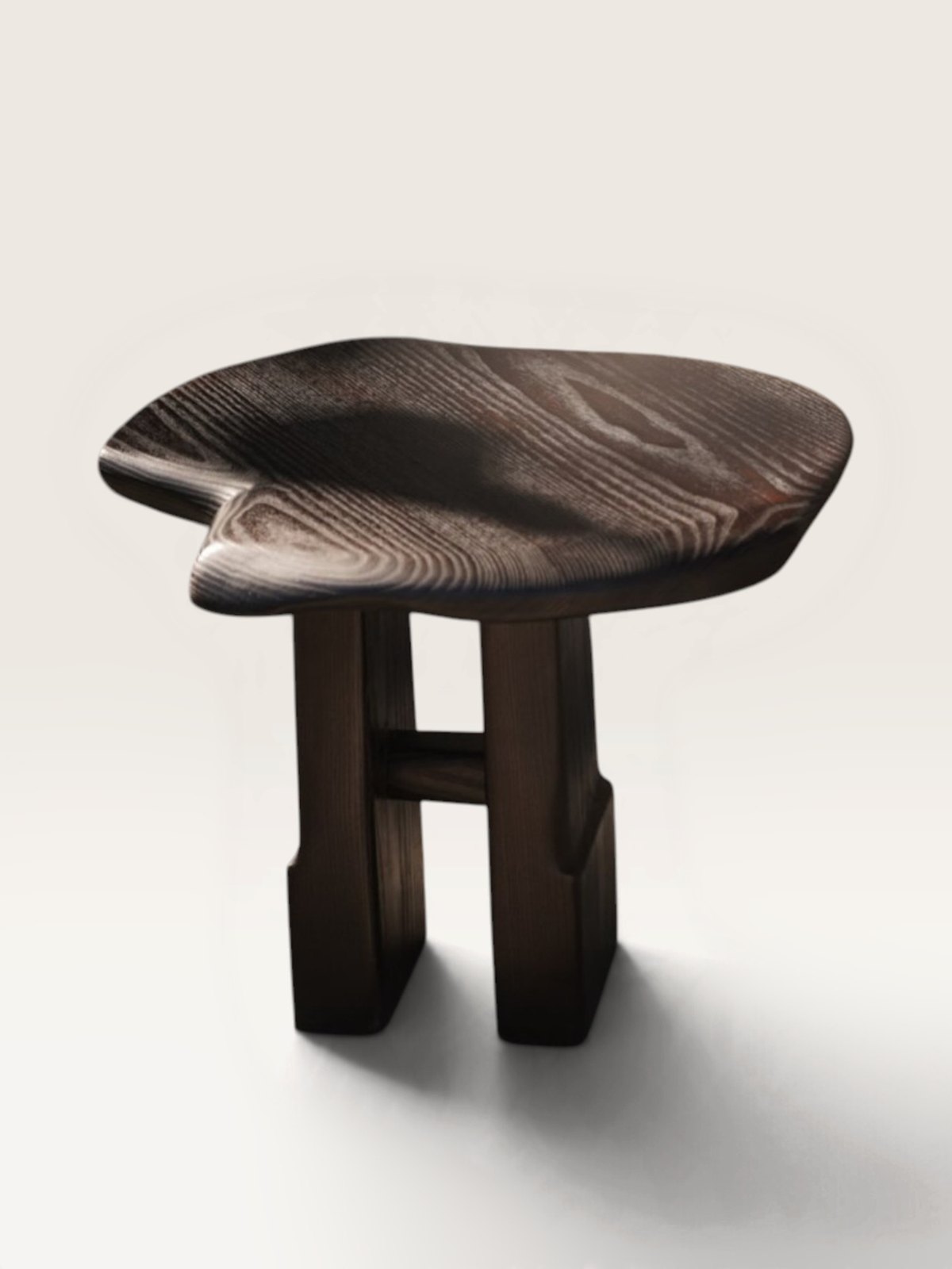 Dark sculptural wood stool